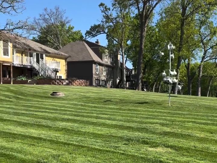 Open lawn with wide, even mowing stripes
